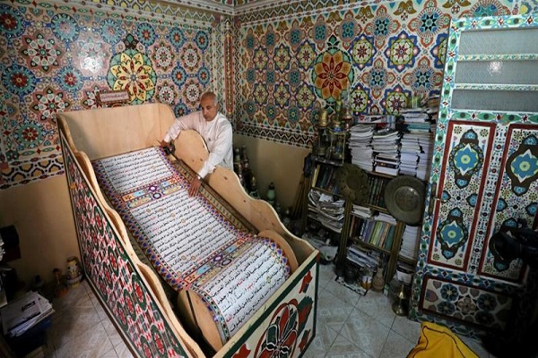Artist Hopes for Guinness Record with 700-Meter Handwritten Quran