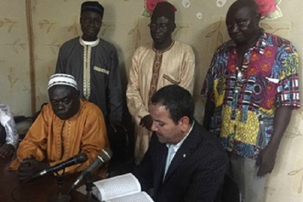 Quran in French Gifted to Director of Radio Senegal