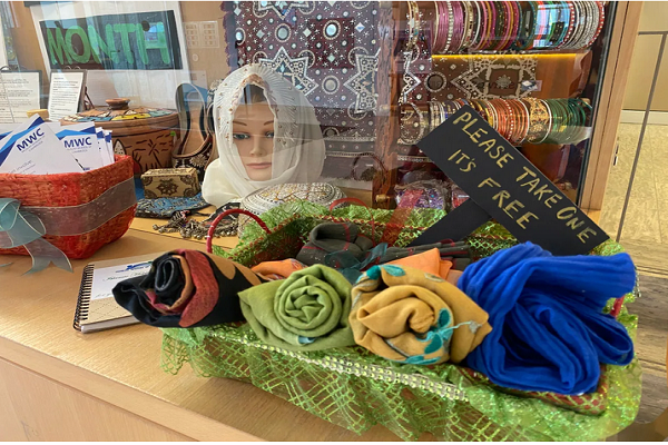 A basket of free hijabs at the display at Cambridge city hall. People are encouraged to take one home.