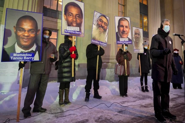 Frank Bayliss, former politician, speaks to a crowd during a commemorative ceremony held to mark the fifth anniversary of the Quebec City Mosque shootings, in Montreal, Saturday, Jan. 29, 2022