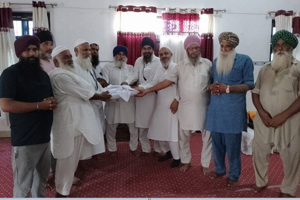 Quran Manuscript Handed Over to Mosque by Sikh Community in India’s Punjab  