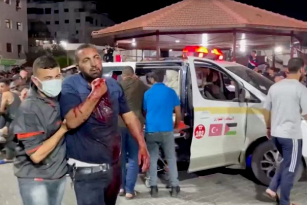 wounded person is taken into a hospital after an Israeli air raid hit a hospital,