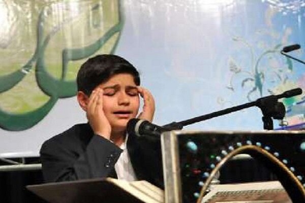A student recites the Quran during a Quran competition