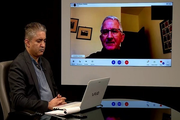 Christopher Clohessy answering questions in an interview with IQNA