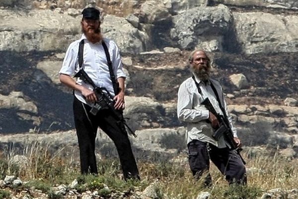 File photo of Israeli settlers carrying weapons