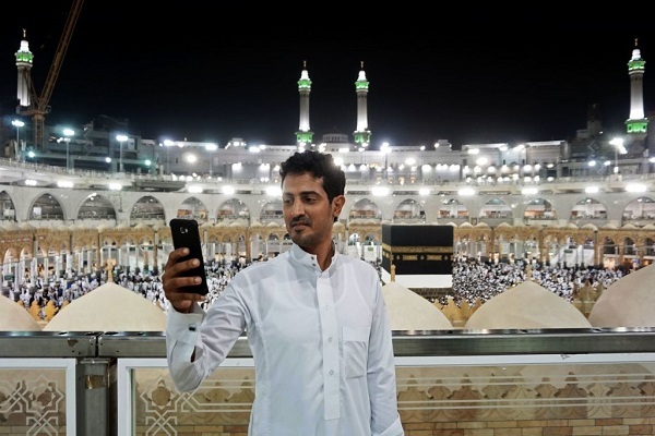 A man taking a selfie at Mecca Grand Mosque