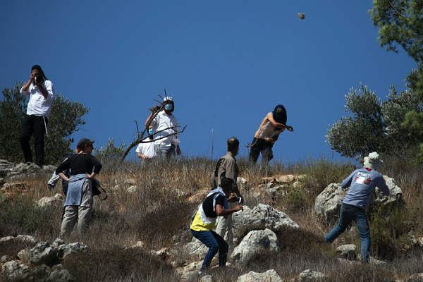 Israeli settlers attack Palestinians in their own homes