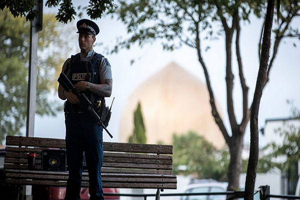Armed police guard the Masjid Al Noor Mosque in Christchurch in 2019