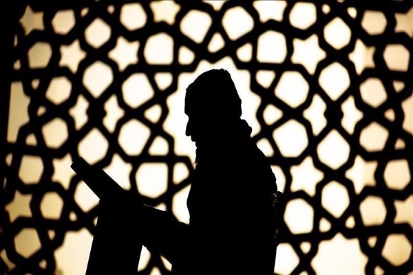 Man reading the Quran