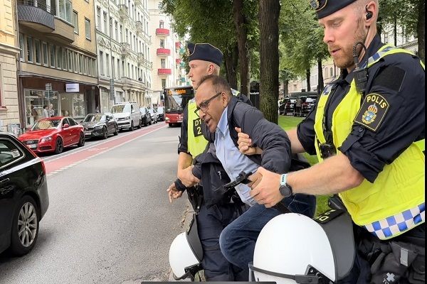 Swedish police detaining Pakistani man