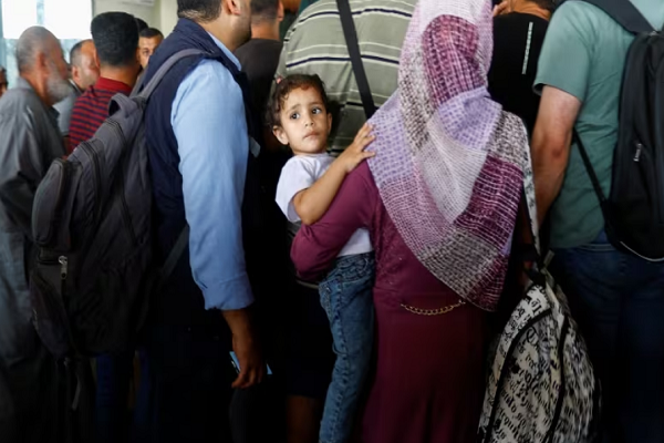 Palestinians at Rafah border crossing between Gaza and Egypt