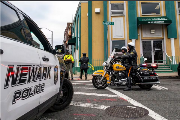 Newark Police Officers stand guard outside the Masjid Muhammad-Newark mosque following the shooting of Imam Hassan Sharif in Newark, New Jersey, U.S., January 3, 2024