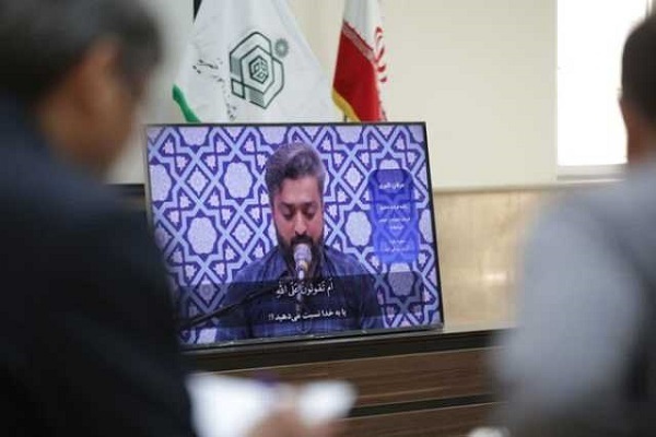 Members of arbiters panel evaluating the pre-recorded performance of a contender in Iran’s 47th National Quran Competition.