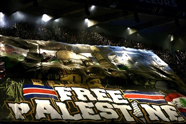 Fans raise ‘Free Palestine’ banner during Paris Saint-Germain v Atletico Madrid match in Paris on November 6, 2024
