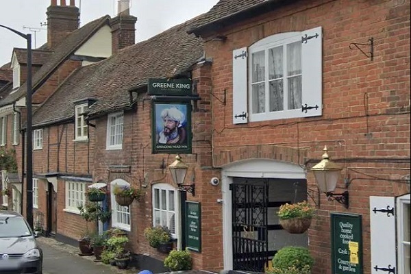 UK Pub Faces Legal Action Over Alleged Racist Sign Depicting Beheaded Arab