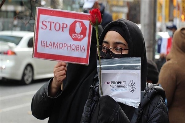 A Muslim woman carrying a