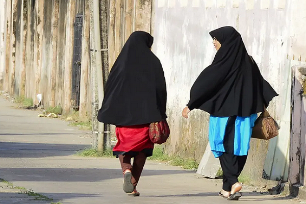 Girls wearing Hijab walk along a road in Kattankudy, Sri Lanka.