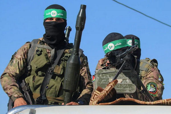 Fighters from the Izzeddin Al-Qassam Brigades, the armed wing of Hamas