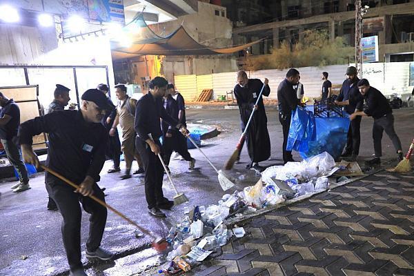 Workers clean Bain-ul-Haramain, an area between the holy shrines of Imam Hussein (AS) and Hazrat Abbas (AS) in Karbala, Iraq, after the 2024 Arabeen procession