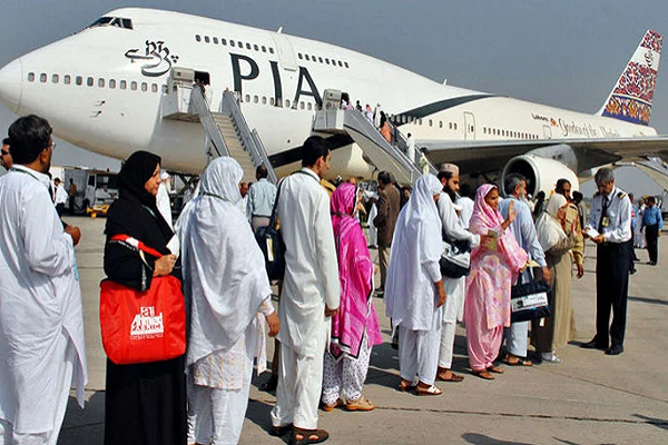 Umrah pilgrims getting onboard a plane