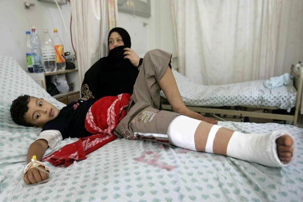 A Palestinian boy wounded in Israeli attacks on the Gaza Strip