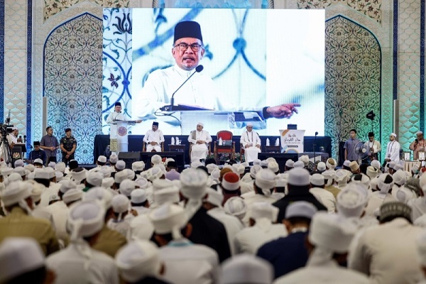 Malaysia’s Prime Minister Anwar Ibrahim addressing a gathering of Quran memorizers in Kuala Lumpur on September 14, 2024.