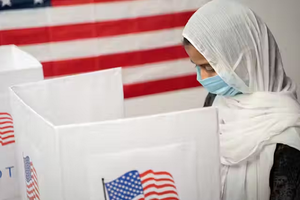 A Muslim woman voting in US elections