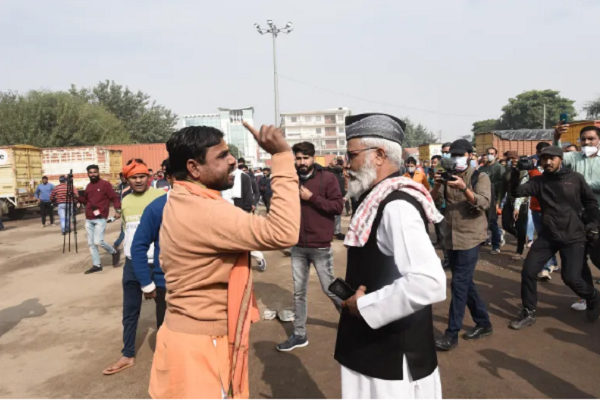 A Hindu vigilante tries to stop an imam from offering prayers at Sector 37 in Gurugram near New Delhi