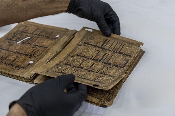 Restoring old Quran in Karbala
