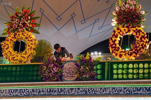 Servants decorating holy shrine of Imam Ali (AS) on occasion of Mid-Shaaban Eid.
