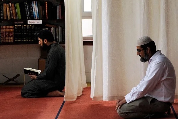 Muslims saying prayers in a mosque or prayer room