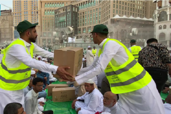 Volunteers serving pilgrims and worshippers in Mecca
