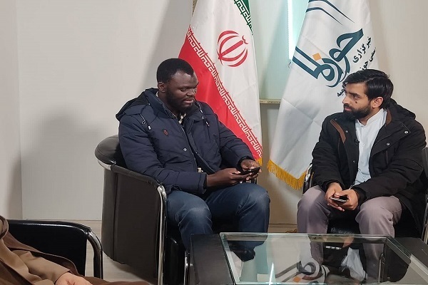 Jamiu Amau Saliou addressing an expert forum at the International Section of the 32nd Tehran International Holy Quran Exhibition on Sunday evening, March 9, 2025.