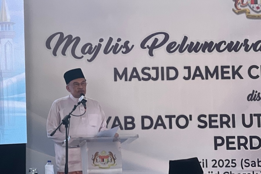 Malaysian Prime Minister Anwar Ibrahim speaking at the groundbreaking ceremony for the rebuilding of Masjid Jamek Cherok Tokun at the mosque compound in Seberang Perai, Penang State, on April 12, 2025.