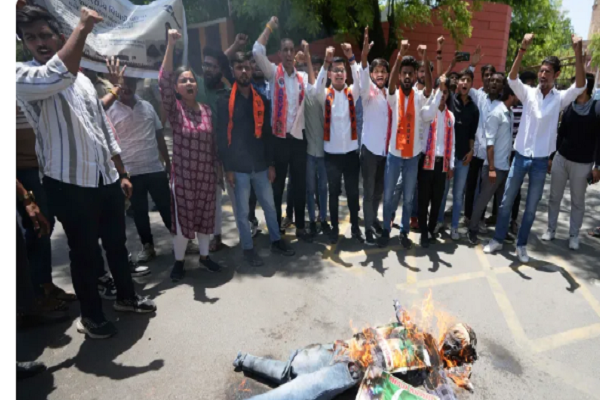 Supporters of the Akhil Bharatiya Vidhyarthi Parishad, a student organisation aligned with India's governing Bharatiya Janata Party, burn an effigy of terrorism and shout slogans against Pakistan after the killing of tourists by gunmen in Pahalgam, Indian-administered Kashmir, in Ahmedabad, India, Thursday, April 24, 2025