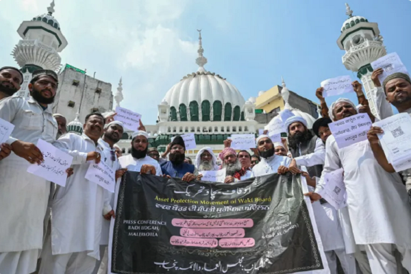 Members of different Islamic groups hold placards during a demonstration against the Waqf Amendment Bill 2024 at the Khairuddin mosque in Amritsar, India