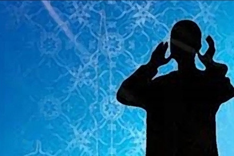 A muezzin reciting Adhan (call to prayer)