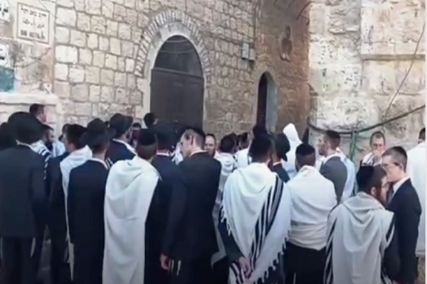 Israeli settlers stand at the entrance to al-Aqsa Mosque compound on June 2, 2025.