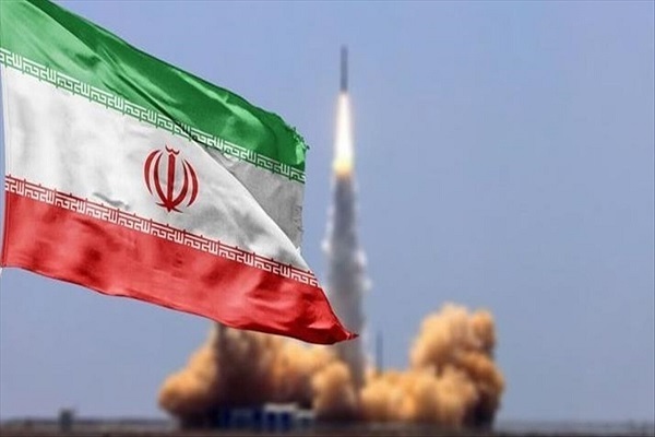 A flag of Iran and a ballistic missile fired in background.