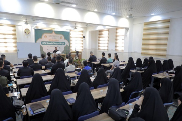 Participants in a specialized training workshop in Karbala, Iraq, on new methods of memorizing the Quran.