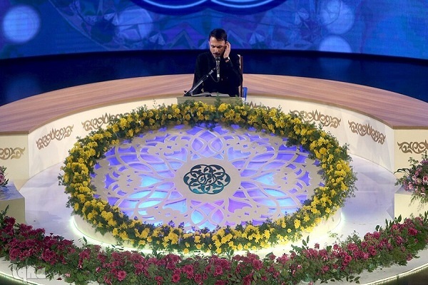 A participant at Iran’s national Quran and Etrat Festival for Students