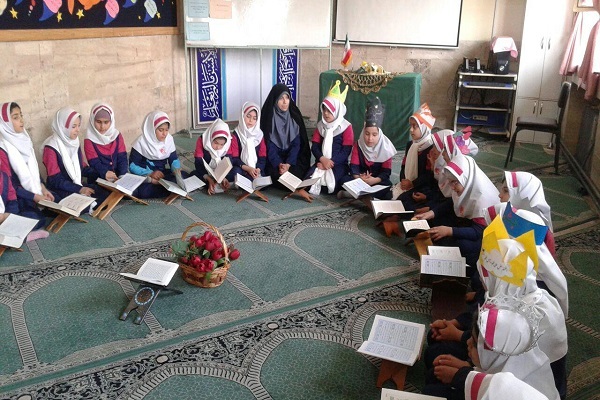 Students learning Quran at a mosque in Iran.