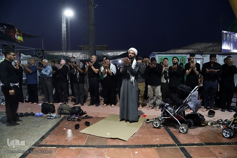 Arbaeen pilgrims performing congregational prayers at a Moukeb in Iraq.