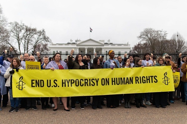 Protesters in DC demand an end to US hypocrisy on human rights.