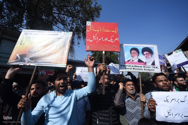 Kashmiri Muslims hold placards as they chant slogans against Israel and the U.S. during a protest against Israel's military operations in Gaza, on October 13, 2023, in Budgam, west of Srinagar, Indian-administered Kashmir, India. (Photo by Mubashir Hassan, IQNA)