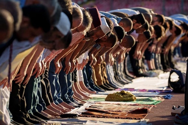 Eid Al Adha prayers, held on the athletics track of the Dinamo Stadium, in Romania's capital Bucharest. AP