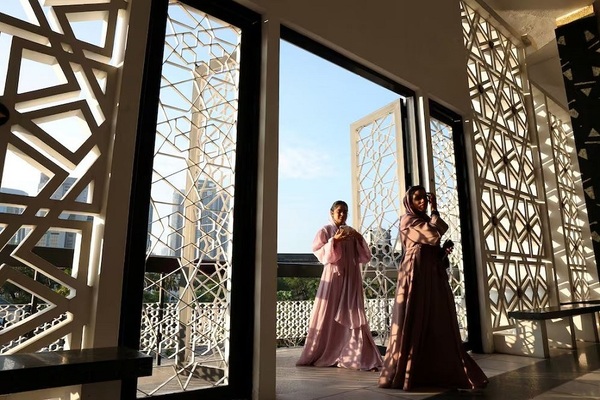 Women enter the hall of a mosque for a mass prayer, during Eid Al Adha celebrations in Malaysia's capital Kuala Lumpur. Reuters

