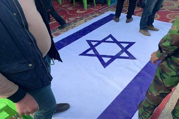 پرچم آمریکا و اسرائیل زیر پای عزاداران «دیاله» عراق/ پیکر المهندس به مرز شلمچه رسید