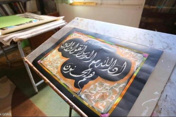 آرزوی خطاط لیبیایی برای کتابت قرآن کریم + عکس