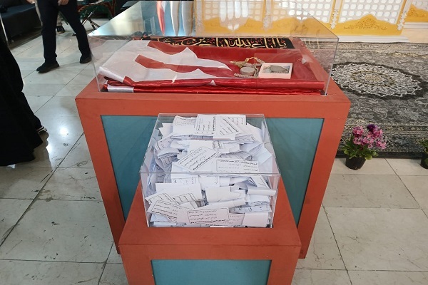 برپایی قرعه‌کشی بزرگ پرچم حسینی در نمایشگاه قرآن + عکس